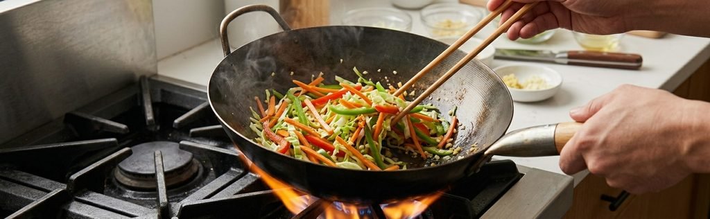 A beautiful collage of step-by-step photos illustrating how to make authentic Chinese chicken noodles, from preparing the fresh ingredients to serving a delicious, finished bowl.